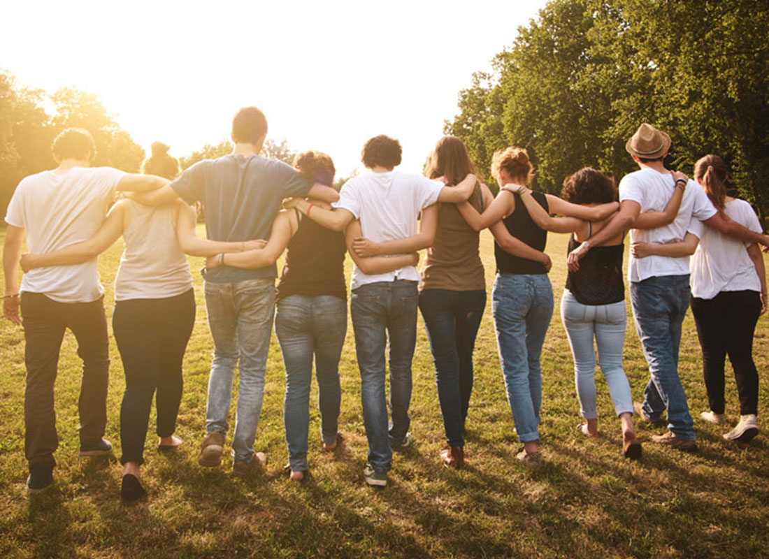 Community Involvement - Group of Volunteers Walking Together After a Long Day of Volunteering