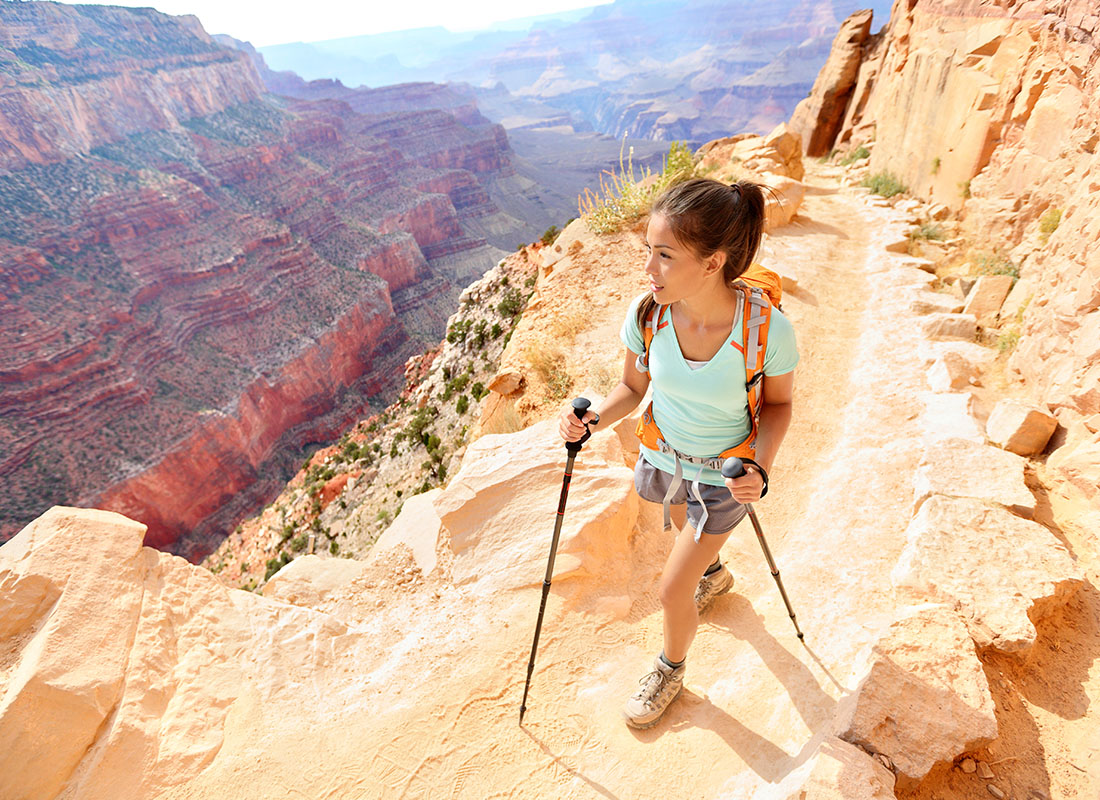 Employee Benefits - Hiker Woman Hiking in Grand Canyon on a Sunny Day