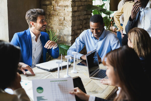 Diverse nonprofit directors and officers in a strategic meeting room, protected by D&O insurance from Conservation United