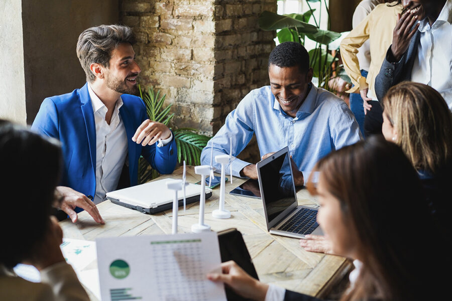 Diverse nonprofit directors and officers in a strategic meeting room, protected by D&O insurance from Conservation United