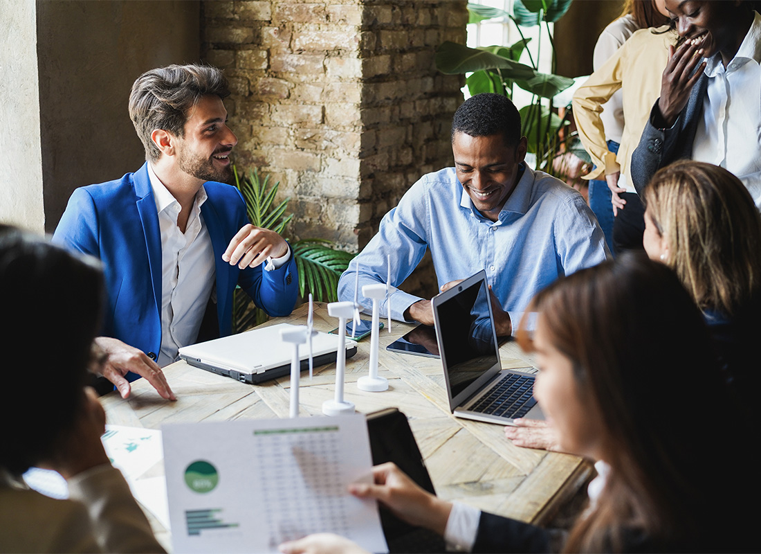 Diverse nonprofit directors and officers in a strategic meeting room, protected by D&O insurance from Conservation United