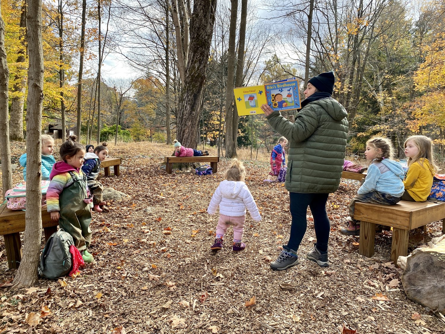 Group of kids learning in woods, engaging with nature to reduce screen time effects
