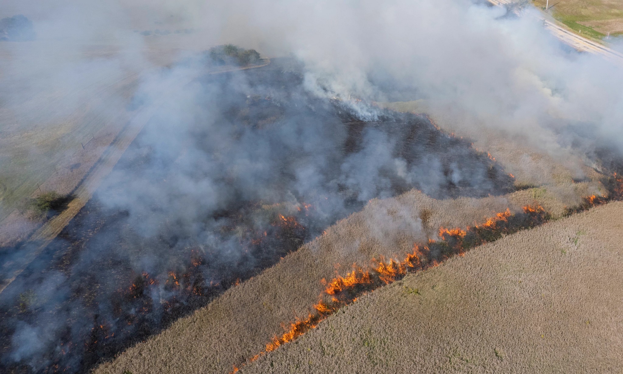 Aerial view of a 2025 prescribed fire operation reducing wildfire fuels in a forested landscape