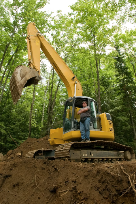 Trail construction team working on an eco-friendly path with Conservation United surety bonds