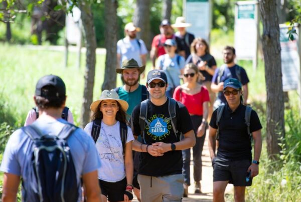 Cyclists on a newly opened resilient trail network, secured through Conservation United's innovative bonding solutions