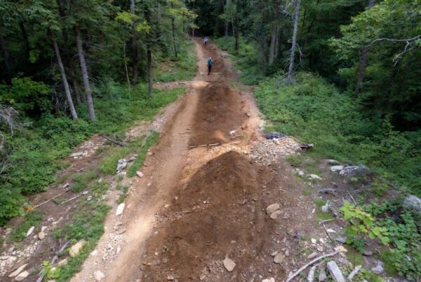 Trail construction on sensitive public lands protected by Conservation United surety bonds in national forest setting